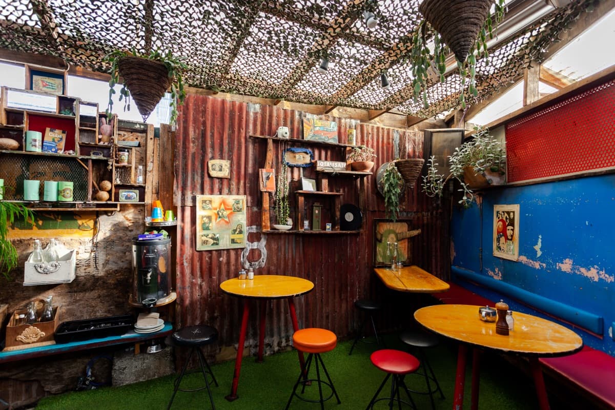 Cuba Street institution for decades and still going strong. Revolutionary décor, strong coffee, and generous brunch plates that keep Wellingtonians coming back every weekend. The cabinet is always loaded, the atmosphere is always buzzing, and the outdoor tables on Wigan Street are prime people-watching territory. Some cafes ride trends — Fidel's just keeps being Fidel's, and that's exactly why it works.